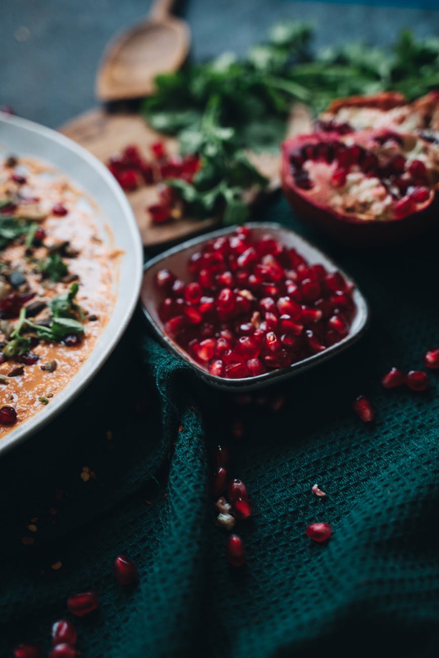 pomegranate in white ceramic bowl